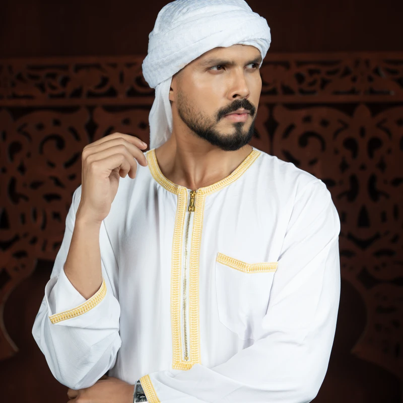" "Sᴛᴇᴘ ɪɴᴛᴏ ᴇʟᴇɢᴀɴᴄᴇ   ✨  White Thobe With Golden Embroidery – Classic, Refined, And Perfect For Every Occasion.